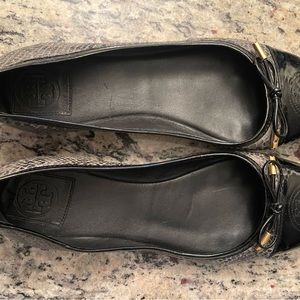 Black and grey Tory Burch snakeskin and patent leather ballet flats.
